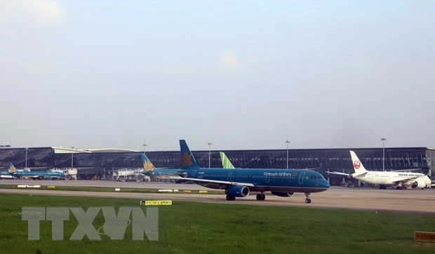 Máy bay của Vietnam Airline đỗ tại sân bay Nội Bài. (Ảnh: Huy Hùng/TTXVN)