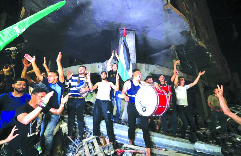 21日凌晨，加沙地區，巴勒斯坦民眾在街頭慶祝。