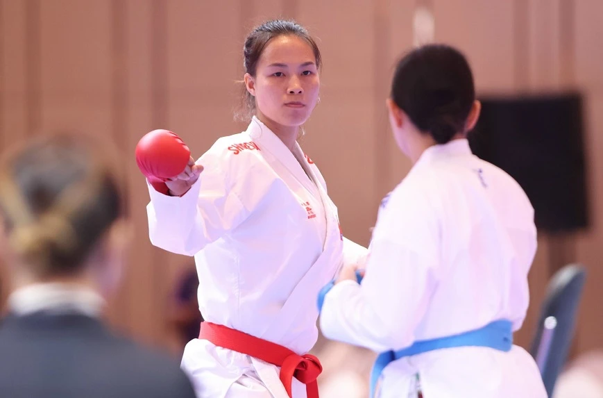 Đinh Thị Hương giành huy chương đầu tiên cho karate Việt Nam tại ASIAD 19. Ảnh: LƯỢNG LƯỢNG