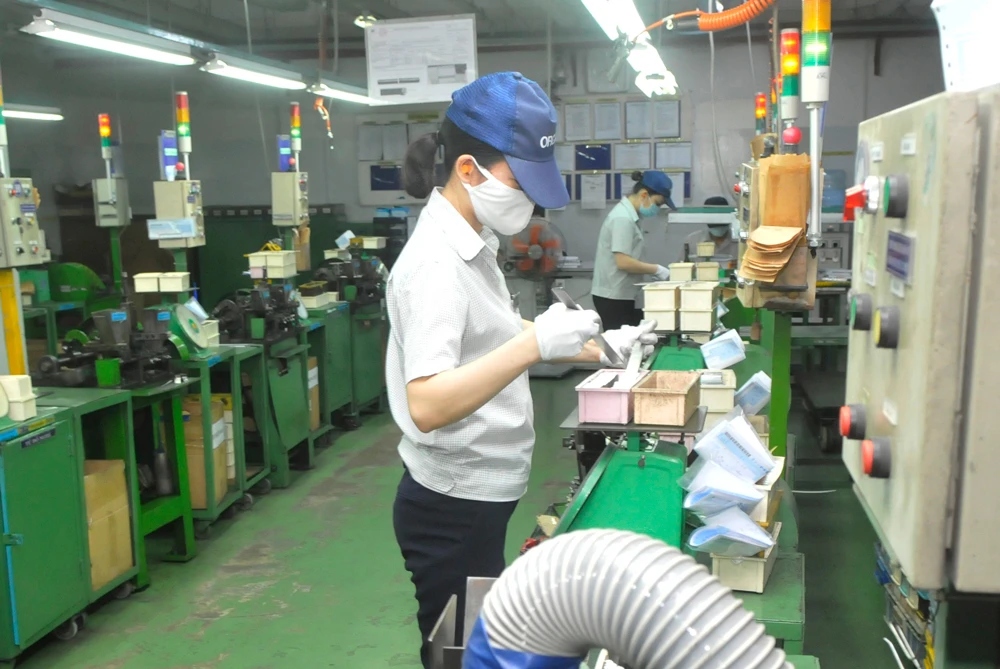 Sản xuất tại Công ty Kim May Organ, KCX Tân Thuận, quận 7. Ảnh: CAO THĂNG