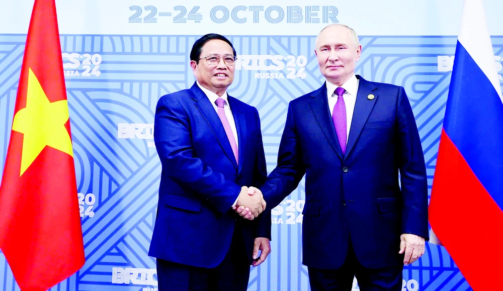 Thủ tướng Phạm Minh Chính với Tổng thống Liên bang Nga Vladimir Putin, Chủ tịch Nhóm BRICS năm 2024. Ảnh: TTXVN