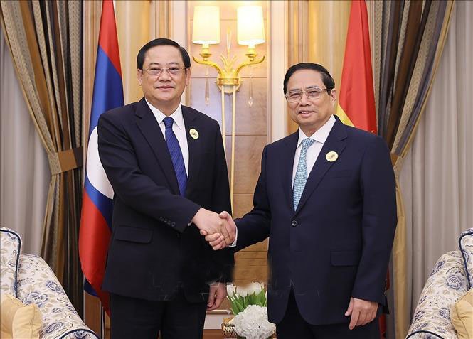 越南政府总理范明政会见了老挝政府总理宋赛·西潘敦。图自越通社