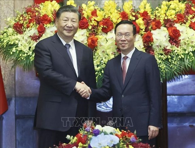 越南国家主席武文赏与中共中央总书记、国家主席习近平合影。图自越通社