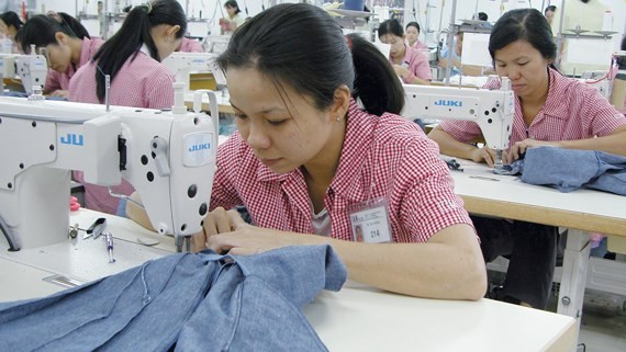 Workers at Japanese company, IGM, in District 7 in Ho Chi Minh City. (Photo: SGGP)