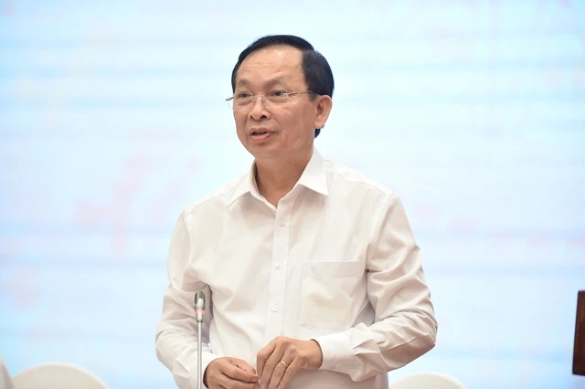 Phó Thống đốc Ngân hàng Nhà nước Việt Nam Đào Minh Tú trả lời báo chí về điều hành tài chính-tiền tệ tại buổi họp báo. Ảnh: VGP