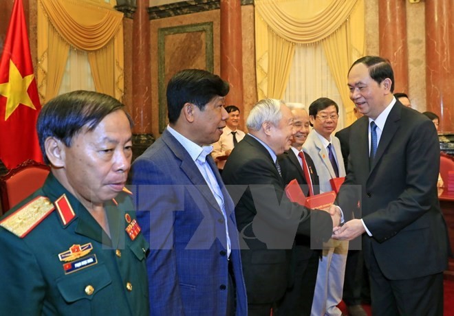President Tran Dai Quang met with Vietnamese former volunteer soldiers who helped Cambodia in the 1979-1989 period. (Photo: VNA)