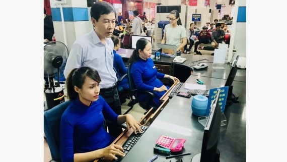 Do Van Quang, Director of the Saigon Railway Transport Joint-Stock Company, inspects a booking stall at Saigon Railway Station.