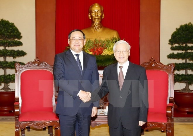 General Secretary of the Communist Party of Vietnam (CPV) Nguyen Phu Trong ​(R) and Lao Deputy Prime Minister Sonexay Siphandone (Source: VNA)