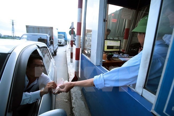 A driver at a BOT toll station. (Photo: VNA)