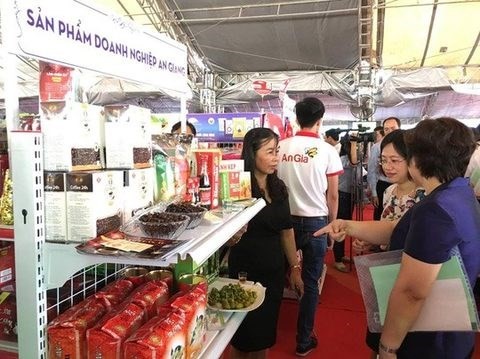 A booth showcasing specialities of An Giang province at the buyer-seller link-up conference held in HCM City last year. (Photo: VNA)