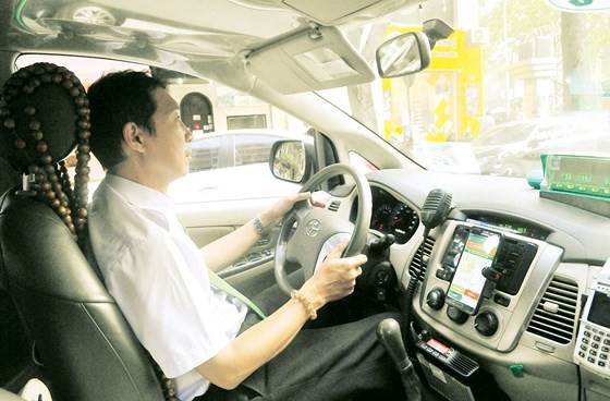 A driver of Mai Linh Taxi  (Photo: Sggp)