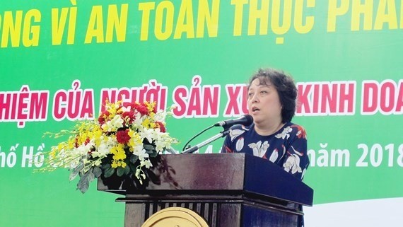 Pham Khanh Phong Lan, head of the HCM City Food Safety Management Board, urges food manufacturers to be more responsible for food safety. (Photo: sggp.org.vn)