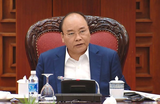 PM Nguyen Xuan Phuc at the working session. (Source: VNA)