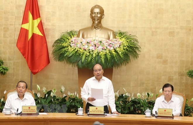 Prime Minister Nguyen Xuan Phuc (middle) at the meeting (Source: VNA)