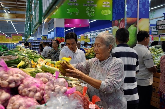 Consumers shop at a supermarket in HCM City (Photo: VNA)