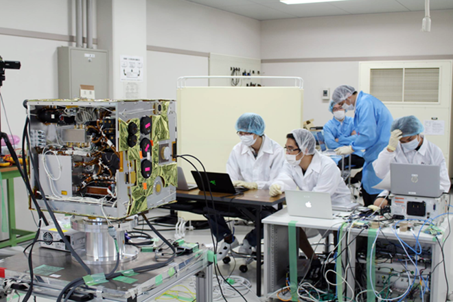 Vietnamese engineers work to develop MicroDragon satellite. 