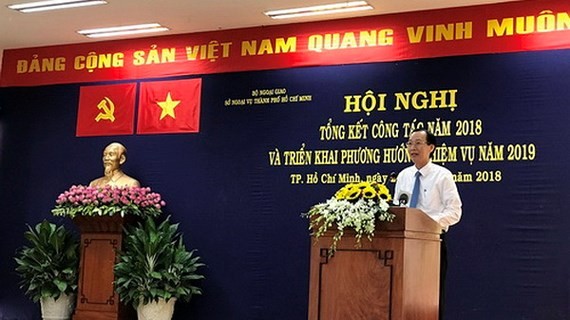 Vice Chairman of the municipal People’s Committee Le Thanh Liem speaks at the conference.