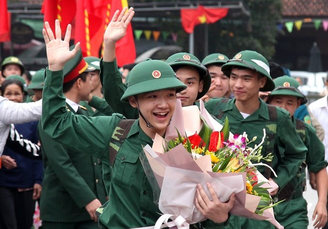 Young people wave at their families at a see-off ceremony in Phu Tho province on February 20 (Photo: VNA)