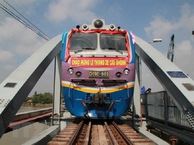 A train travels on the Ghenh Bridge. Most bridges on the railway connecting Hanoi and HCM City were built a century ago using French standards with low capacities. (Photo: VNA/VNS)
