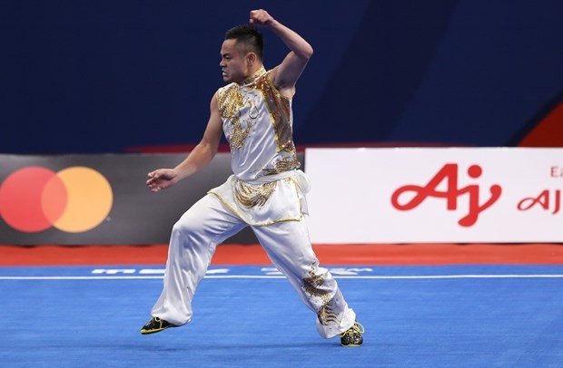 Wushu martial artist Pham Quoc Khanh snatches the first gold medal on December 3. (Photo: VNA)