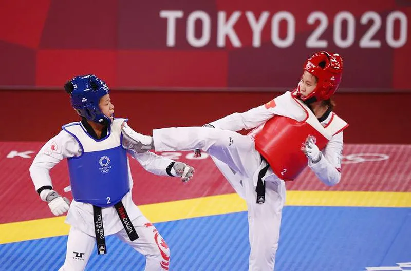 Võ sĩ Trương Thị Kim Tuyền thi đấu tại Olympic. Ảnh: REUTERS