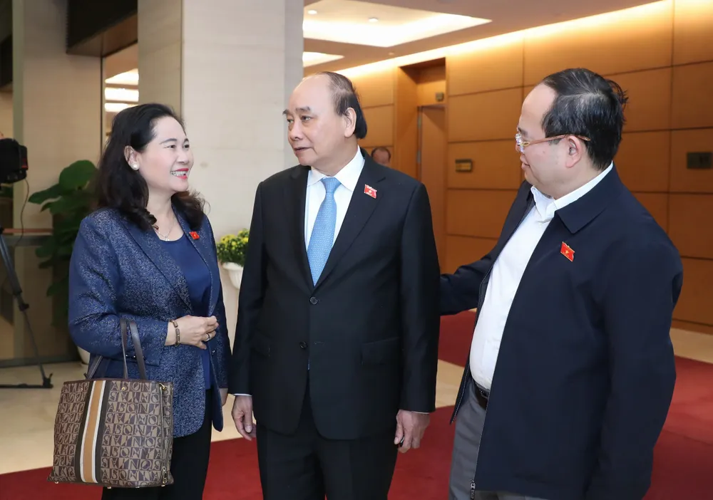 Chủ tịch nước Nguyễn Xuân Phúc trao đổi với ĐB Nguyễn Thị Lệ, Chủ tịch HĐND TPHCM bên hành lang Quốc hội chiều 6-1. Ảnh: QUANG PHÚC Chủ tịch nước Nguyễn Xuân Phúc trao đổi với ĐB Nguyễn Thị Lệ, Chủ tịch HĐND TPHCM bên hành lang Quốc hội chiều 6-1. Ảnh: QUANG PHÚC