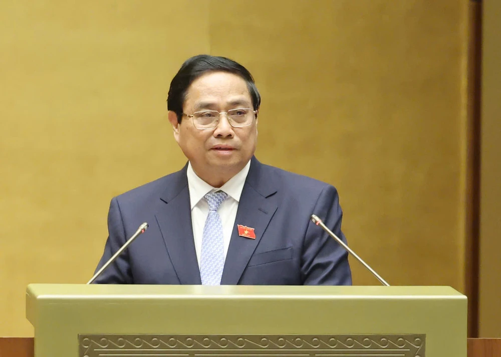 Thủ tướng Phạm Minh Chính trình bày báo cáo đánh giá bổ sung kết quả thực hiện kế hoạch phát triển kinh tế - xã hội và ngân sách nhà nước năm 2024. Ảnh: QUANG PHÚC Thủ tướng Phạm Minh Chính trình bày báo cáo đánh giá bổ sung kết quả thực hiện kế hoạch phát triển kinh tế - xã hội và ngân sách nhà nước năm 2024.jpg