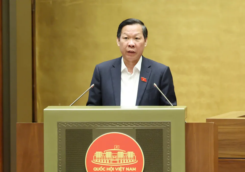 Chủ nhiệm Ủy ban Kinh tế và Tài chính của Quốc hội Phan Văn Mãi trình bày báo cáo thẩm tra dự thảo Nghị quyết của Quốc hội về Trung tâm Tài chính quốc tế tại Việt Nam, sáng 11-6. Ảnh: QUANG PHÚC Chủ nhiệm Ủy ban Kinh tế và Tài chính của Quốc hội Phan Văn Mãi trình bày báo cáo thẩm tra dự thảo Nghị quyết của Quốc hội về Trung tâm Tài chính quốc tế tại Việt Nam, sáng 11-6. Ảnh QUANG PHÚC.jpg