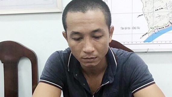 Viet gives himself to police (Photo: SGGP)