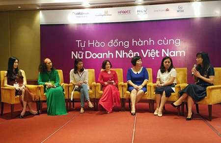 Vietnamese businesswomen are discussing the project DevelopHer at its introduction on June 14 in Hanoi. Photo by Tran Binh