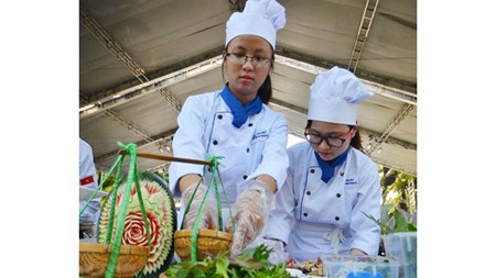 Young cooks are displaying their dishes in a tourism festival in Ho Chi Minh City