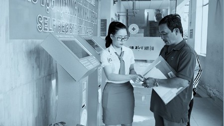 Patients are checking in a hospital using the kiosk system 