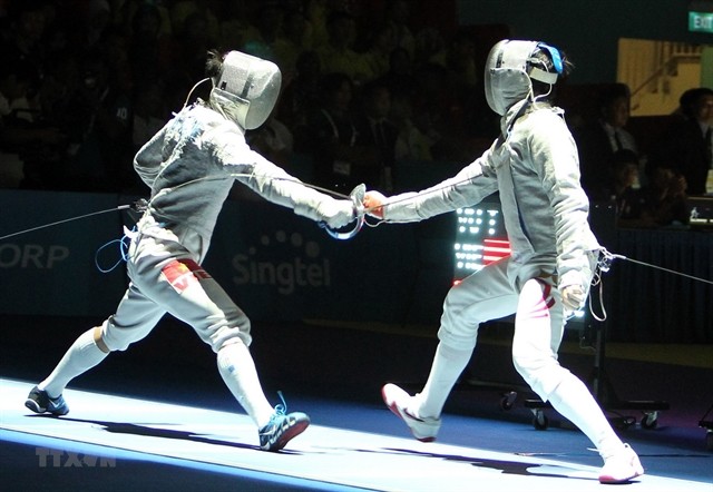 Vu Thanh An (left) competes at the 30th SEA Games last December in the Philippines. An is expecting to win his second Olympic berth in Tokyo this year. VNA/VNS Photo