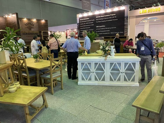 Customers visit an exhibition of wood furniture in HCMC Customers visit an exhibition of wood furniture in HCMC