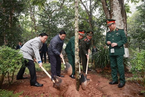 PM Pham Minh Chinh joins in tree planting at the relic site (Photo: VNA) PM Pham Minh Chinh joins in tree planting at the relic site (Photo: VNA)