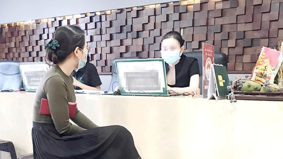 A woman listens to consultation at a beauty salon in HCMC A woman listens to consultation at a beauty salon in HCMC