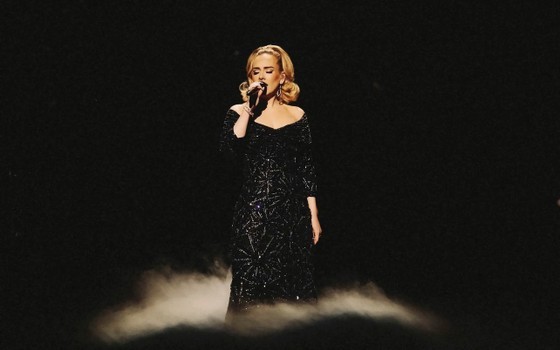 English pop singer-songwriter Adele in the outfit designed by Nguyen Cong Tri at her performance English pop singer-songwriter Adele in the outfit designed by Nguyen Cong Tri at her performance