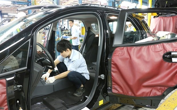 Workers assemble an auto at Ford Vietnam's Hai Duong assembly facility. (Photo: VNA) Workers assemble an auto at Ford Vietnam's Hai Duong assembly facility. (Photo: VNA)