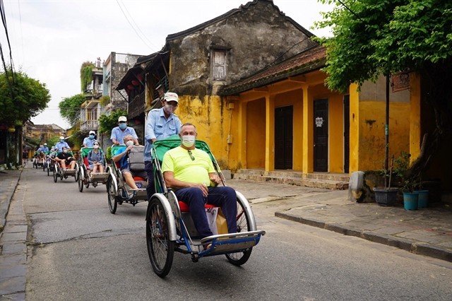 Tourists in Hoi An. Foreign businesses dominate the online travel agency channel in Vietnam. — VNA/VNS Photo Tourists in Hoi An. Foreign businesses dominate the online travel agency channel in Vietnam. — VNA/VNS Photo
