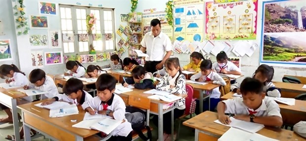 Teacher Nay Khon in the classroom that was re-decorated by him and his students. (Photo: VNA) Teacher Nay Khon in the classroom that was re-decorated by him and his students. (Photo: VNA)