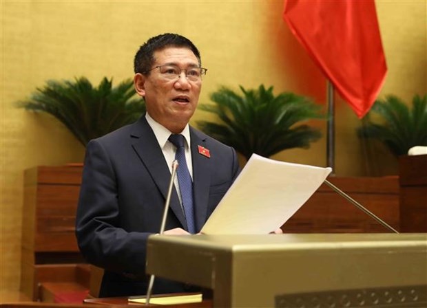 Minister of Finance Ho Duc Phoc delivers the Government&apos;s report on thrift practice and wastefulness prevention in 2022 at the 15th NA&apos;s fifth session on May 23. (Photo: VNA)