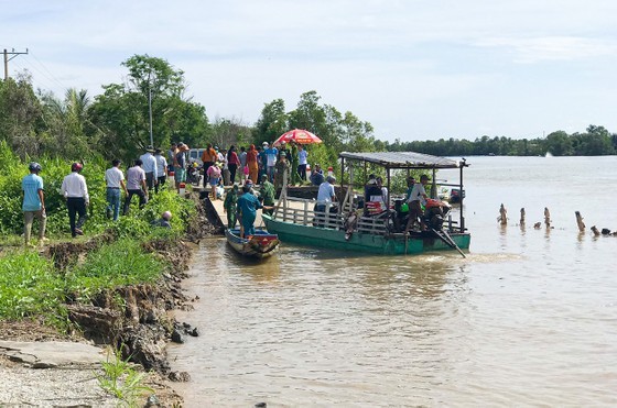 Erosion seperates a road in the Mekong Delta province