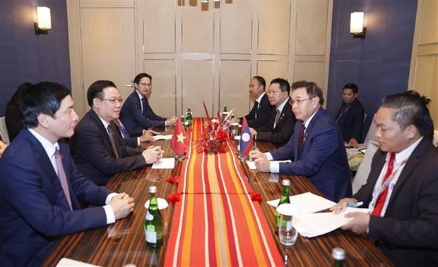 At the meeting between Vietnamese National Assembly (NA) Chairman Vuong Dinh Hue and his Lao counterpart Saysomphone Phomvihane in in Jakarta, Indonesia, on August 7. (Photo: VNA) At the meeting between Vietnamese National Assembly (NA) Chairman Vuong Dinh Hue and his Lao counterpart Saysomphone Phomvihane in in Jakarta, Indonesia, on August 7. (Photo: VNA)