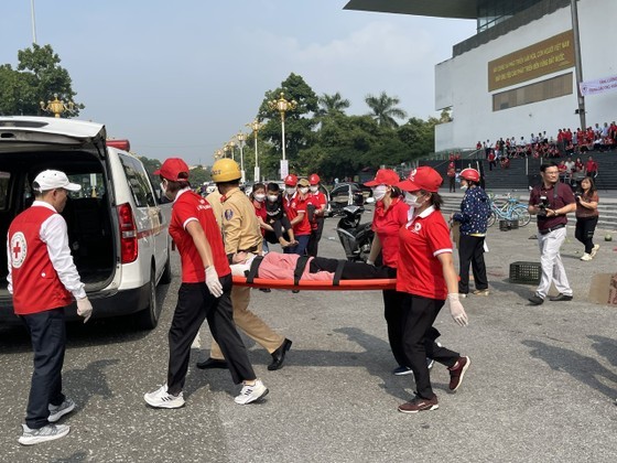 Staff of the Vietnam Red Cross Association rehearse first aid practice for traffic accident victims