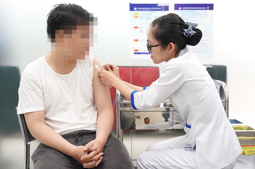 A man receives a rabies vaccine. A man receives a rabies vaccine.