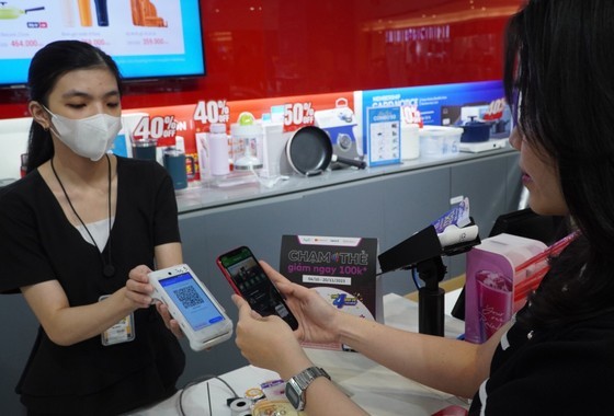 A woman scan QR for paying. Payment via QR code has become a popular payment trend