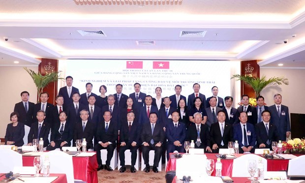 CPV and CPC officials pose for a group photo at the 18th theoretical workshop in HCMC on January 12. (Photo: VNA) cpv-cpc-hold-18th-theoretical-workshop-1997.jpg