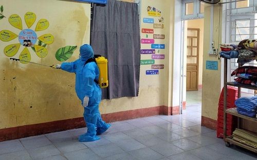 A health worker sprays infectant to disinfect the school where the first case of chickenpox is studying chickenpox-5236.jpg