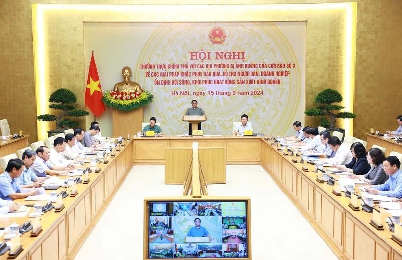 Prime Minister Pham Minh Chinh chairs an online conference of permanent Government members with representatives of localities affected by Typhoon Yagi on September 15 morning. (Photo: VNA) pm-online-conference-7638.jpg.webp