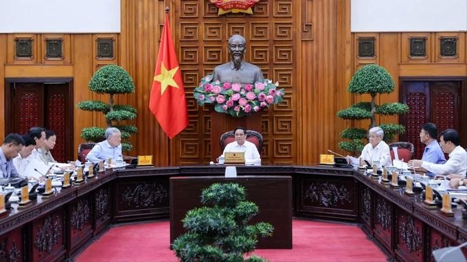 PM Pham Minh Chinh chairs the meeting nha dot.webp